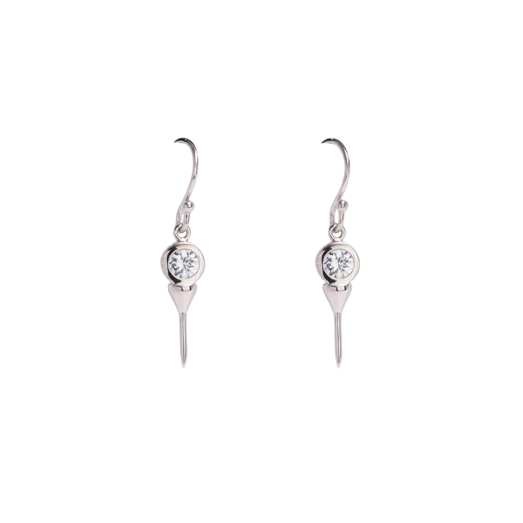 Silver golf pendant with a clear gemstone on a white background