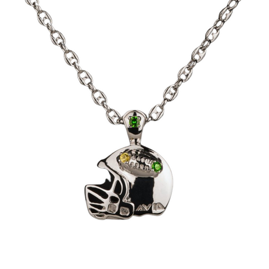 Silver necklace with a football helmet pendant featuring green gemstones on a white background