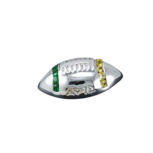 Silver ring with green and yellow gemstones on a white background