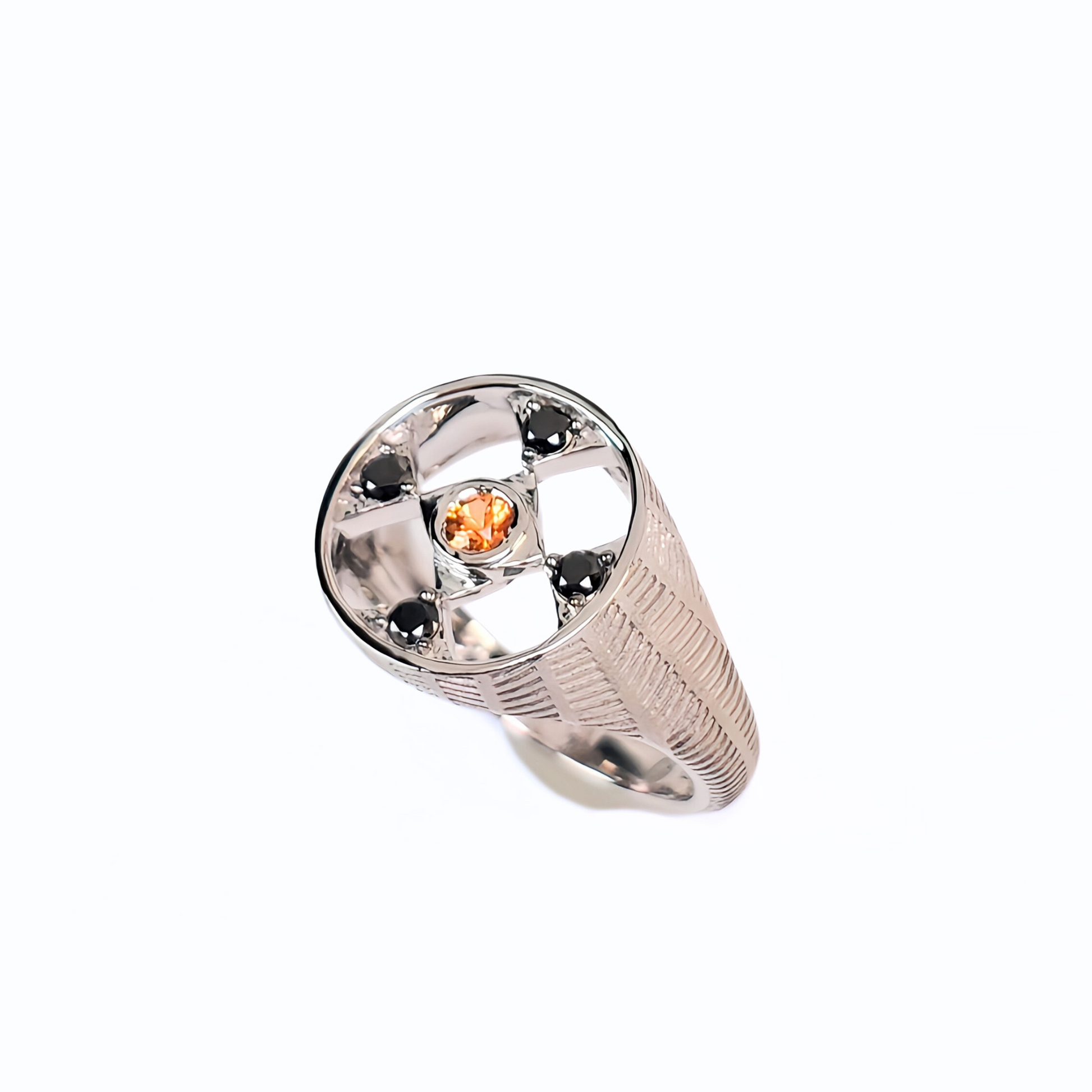 Silver ring with a central orange gemstone on a white background