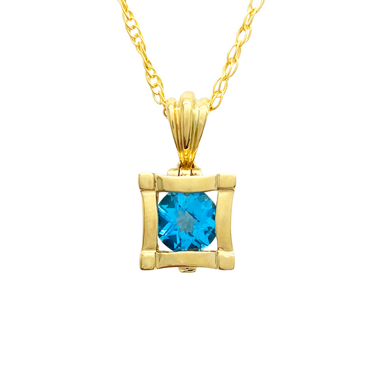 Gold pendant with a round topaz in a square bezel setting.