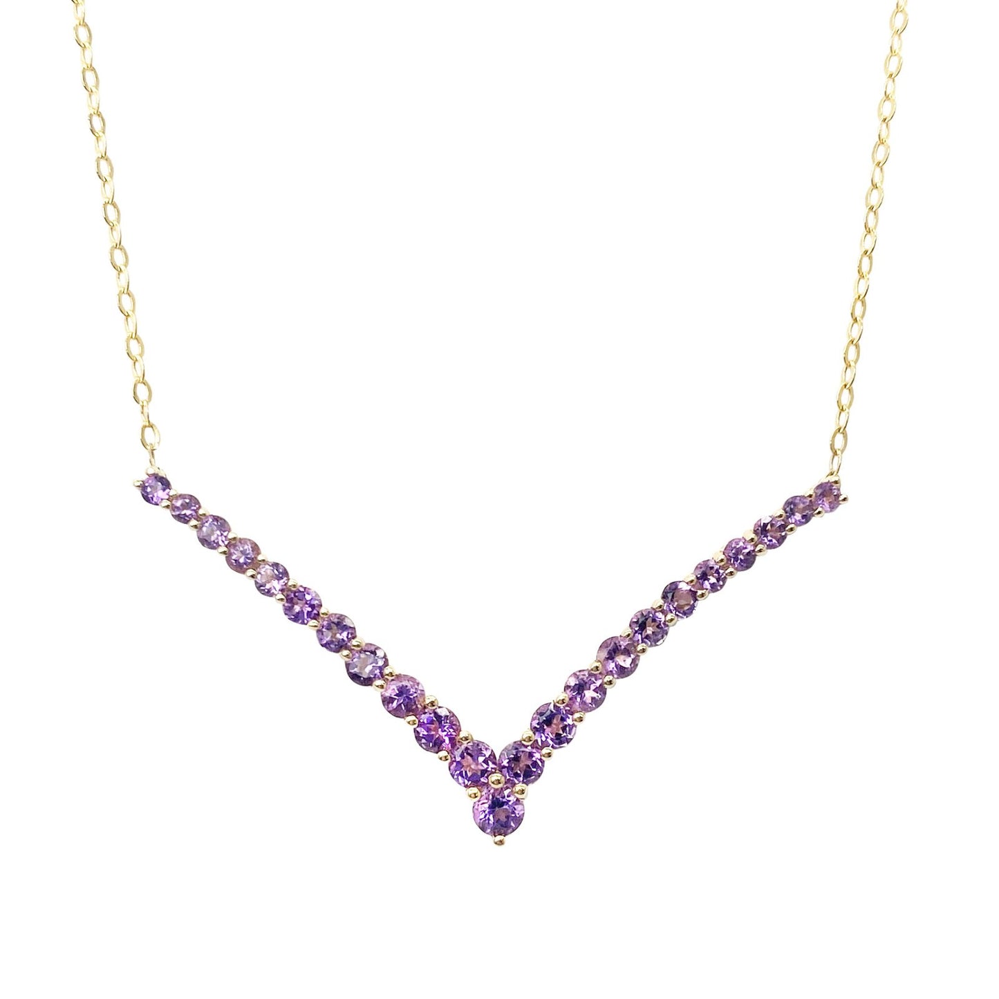 Gold necklace with a v-shaped pendant set with amethyst stones. The background is white.