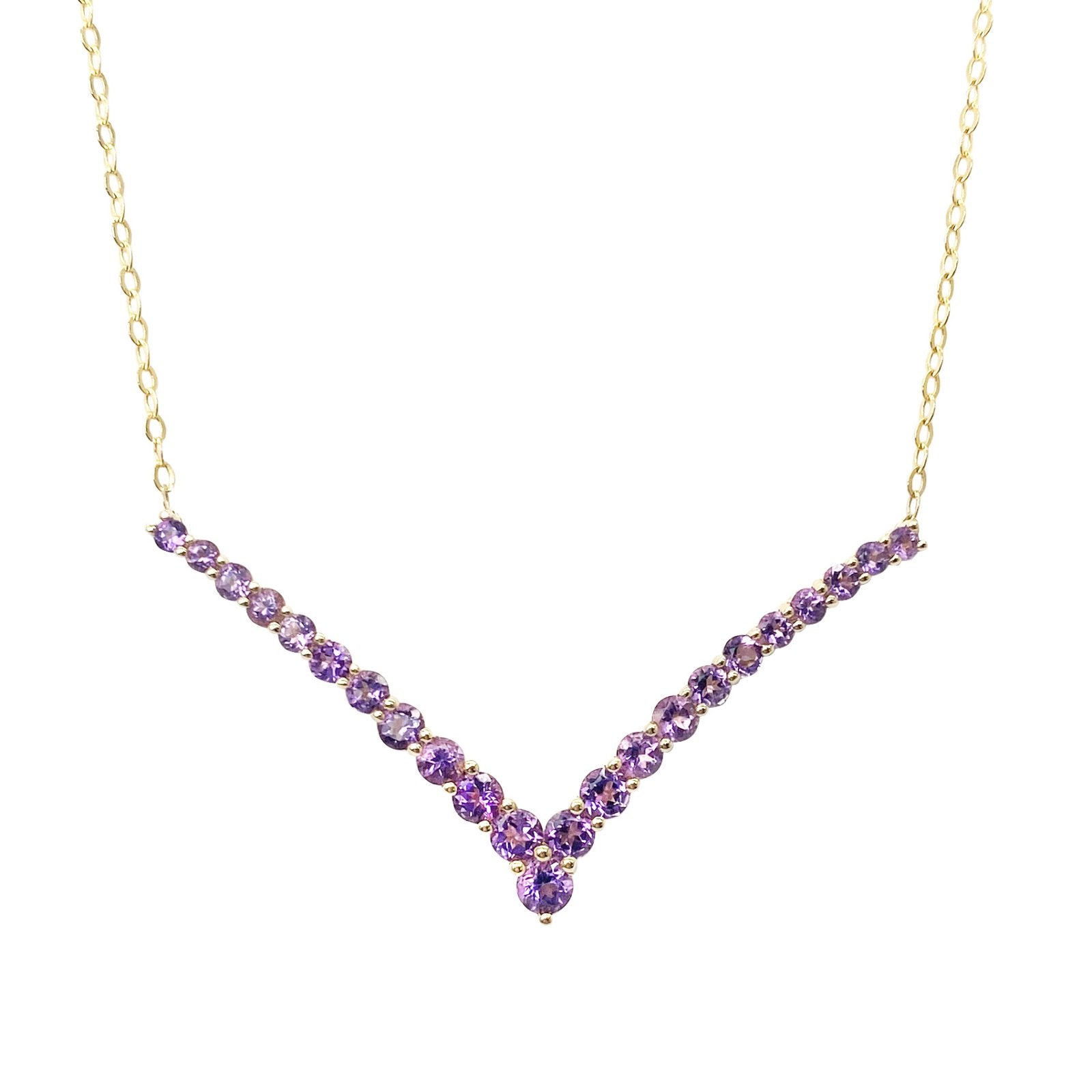 Gold necklace with a v-shaped pendant set with amethyst stones. The background is white.