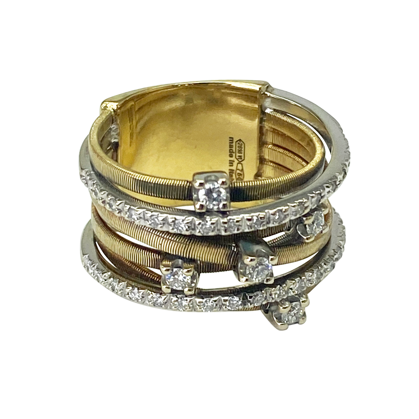 Multi-strand gold and diamond coil ring.