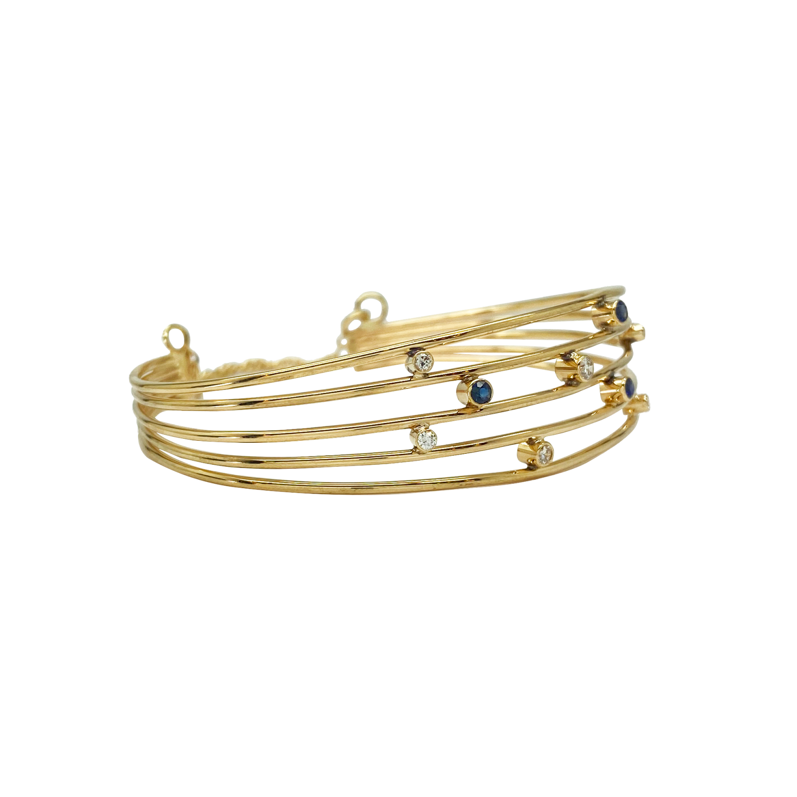 Multi-strand gold bangle bracelet with blue and clear beads.