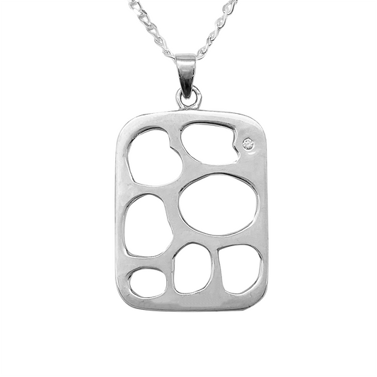 Silver necklace with a square pendant featuring a unique hole pattern