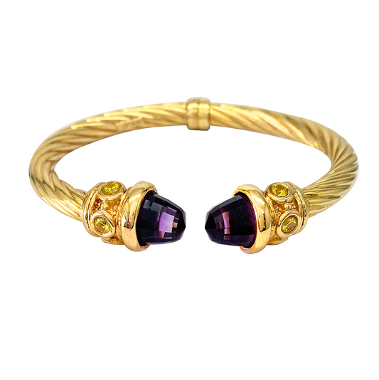 Gold bangle bracelet with twisted design and amethyst gemstones at each end, accented with yellow citrine stones