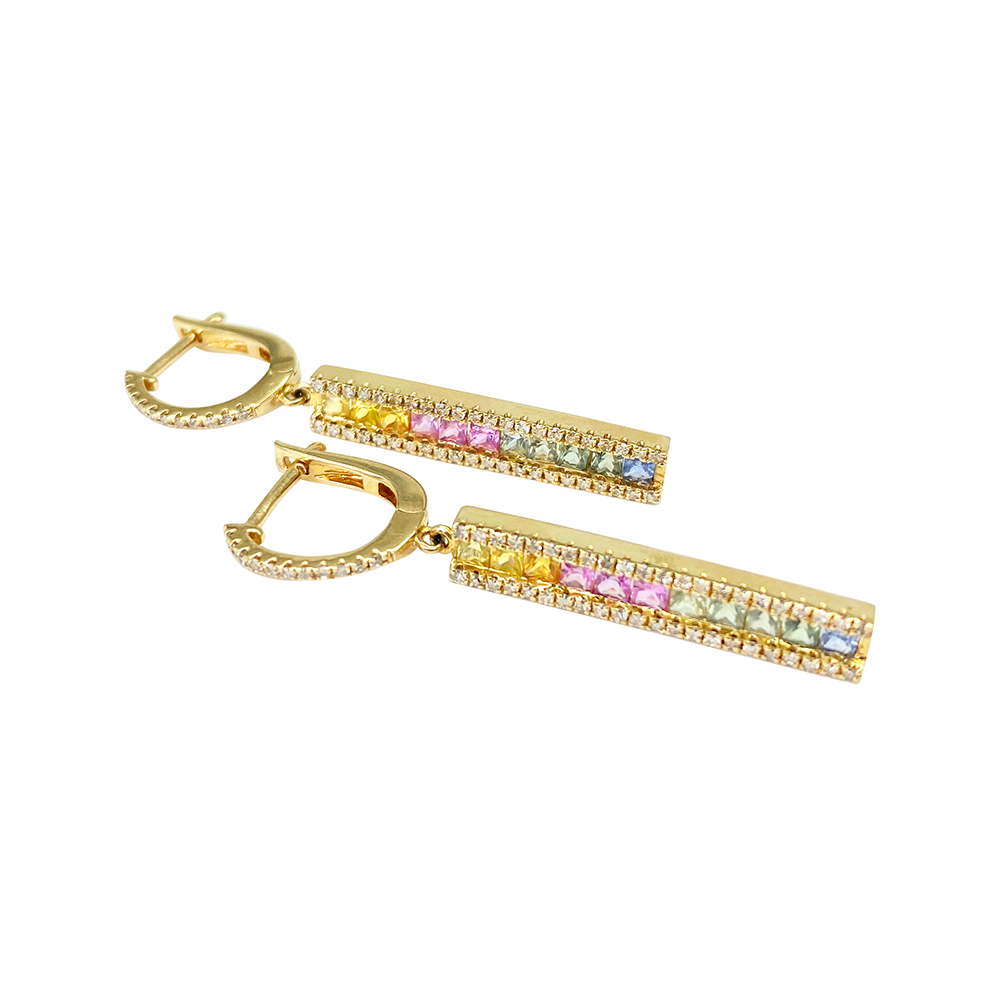 Gold earrings with colorful gemstones on a white background