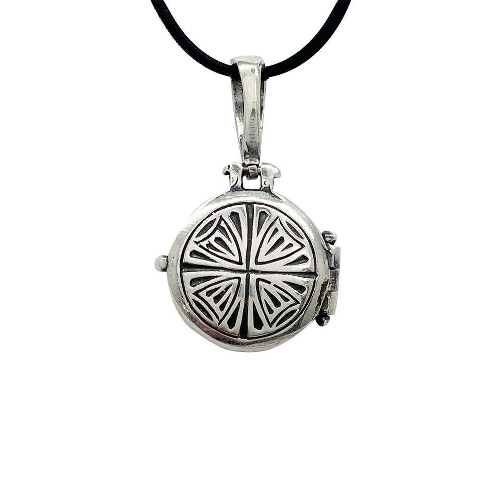 Silver locket necklace with a round pendant featuring a geometric cross design.