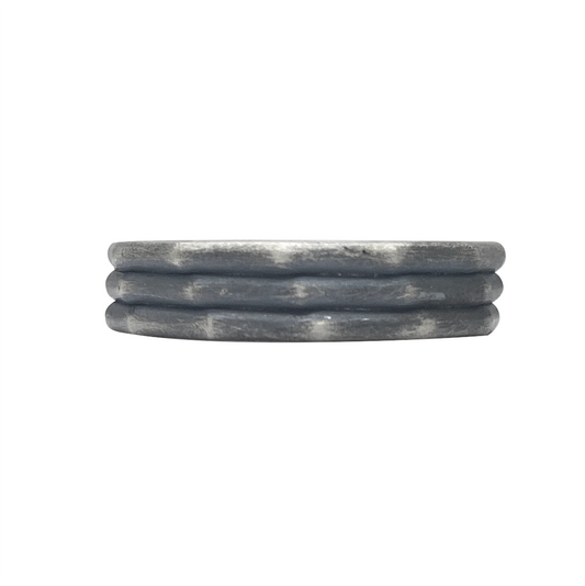Gray stone coaster with a wavy pattern, on a white background.