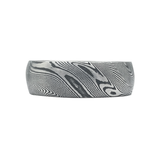 Silver ring with a Damascus steel pattern, on a white background.