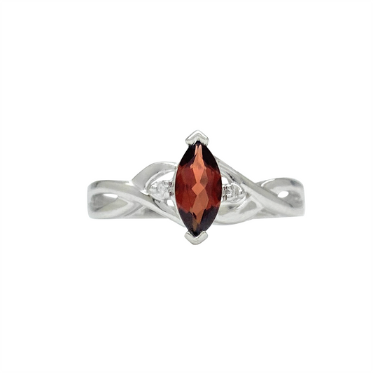 Silver ring with a marquise-cut garnet center stone and diamond accents, on a white background.