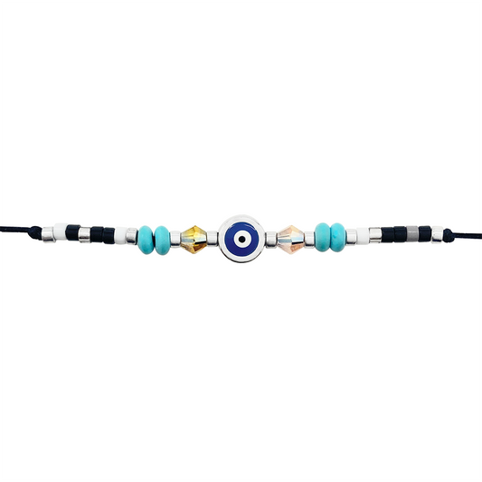 Black cord bracelet with a blue evil eye charm, turquoise beads, and crystal beads on a white background
