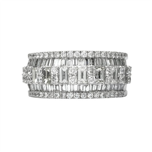 White gold ring with multiple rows of baguette-cut diamonds, alternating with rows of smaller round diamonds, on a white background.