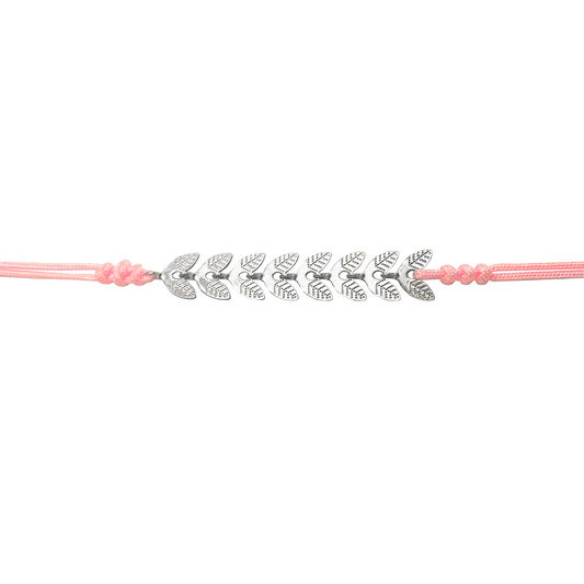 Pink cord bracelet with silver leaf-shaped charms on a white background