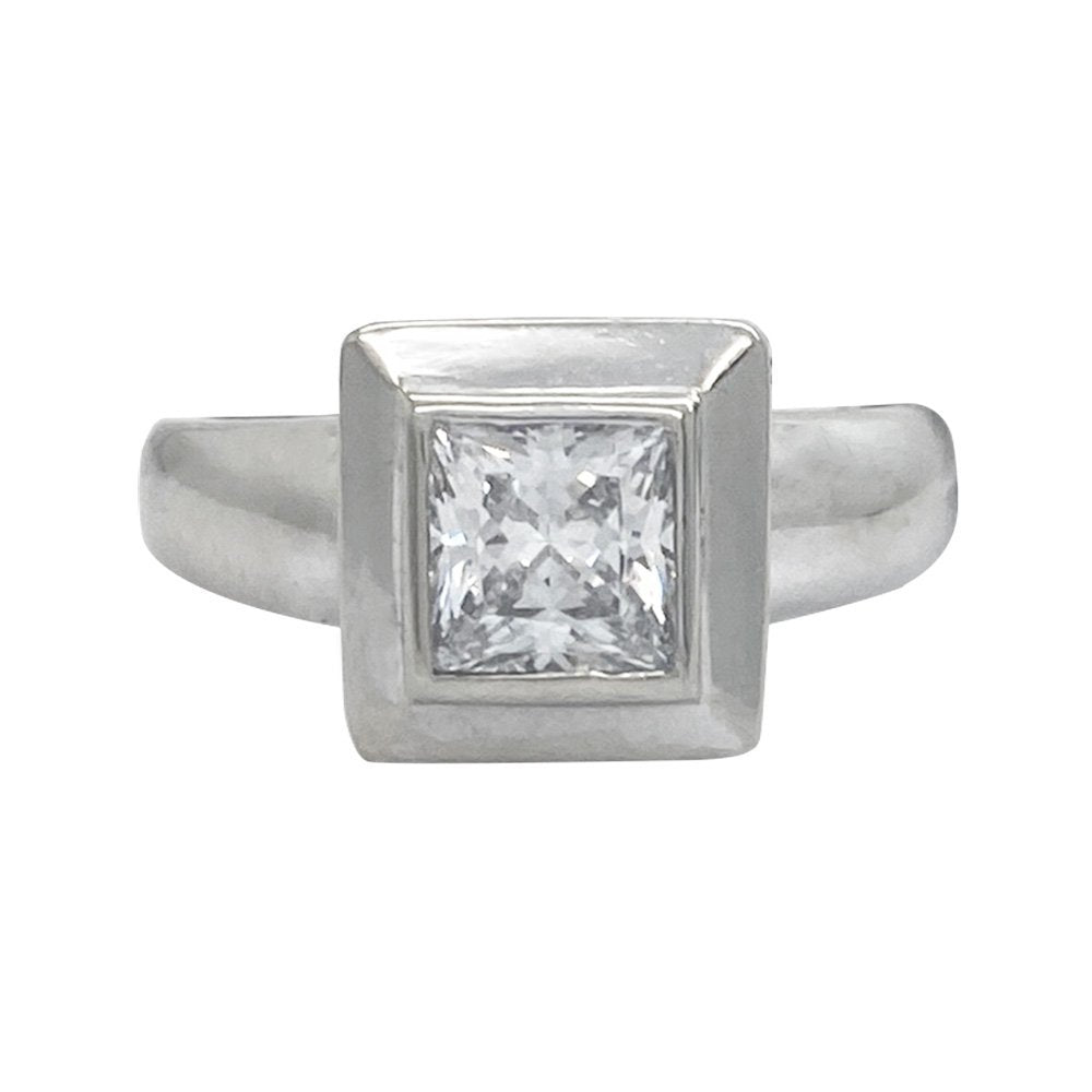 Silver ring featuring a single princess-cut diamond set in a square bezel