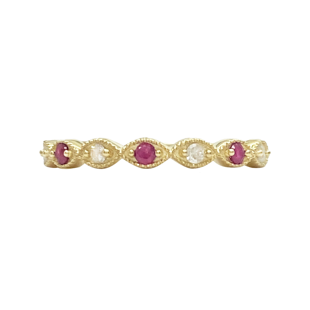 Gold band with alternating oval rubies and diamonds, set in marquise.