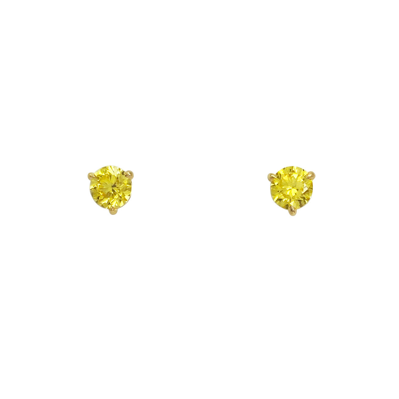 Pair of gold yellow diamond stud earrings on  a white background.