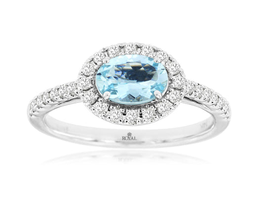 Silver ring with a blue gemstone and diamond accents on a white background