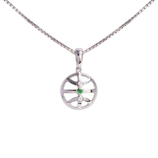 Silver pendant with a green gemstone on a white background