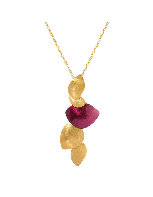 Gold and red pendant necklace on a white background