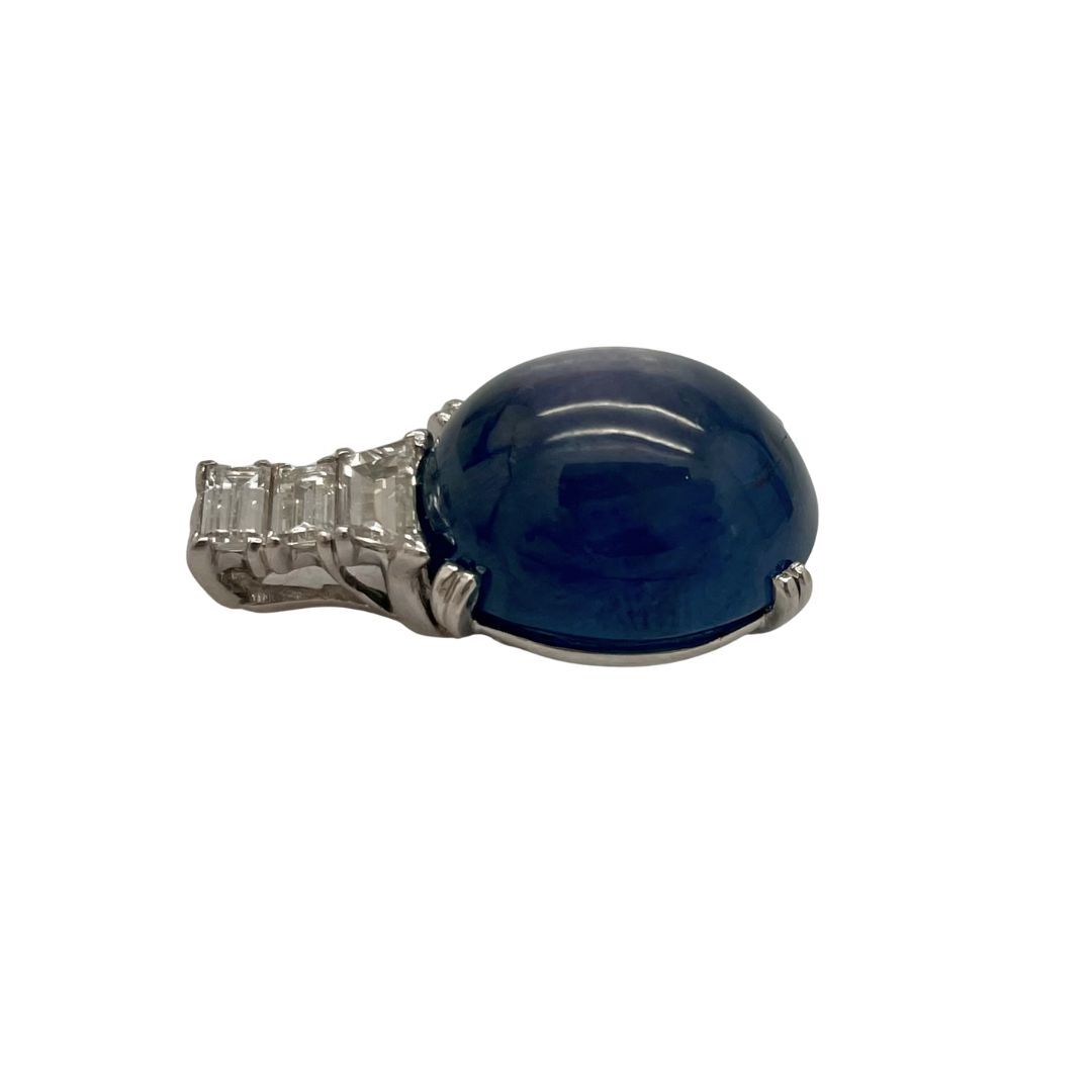 Blue sapphire gemstone pendant on a white background