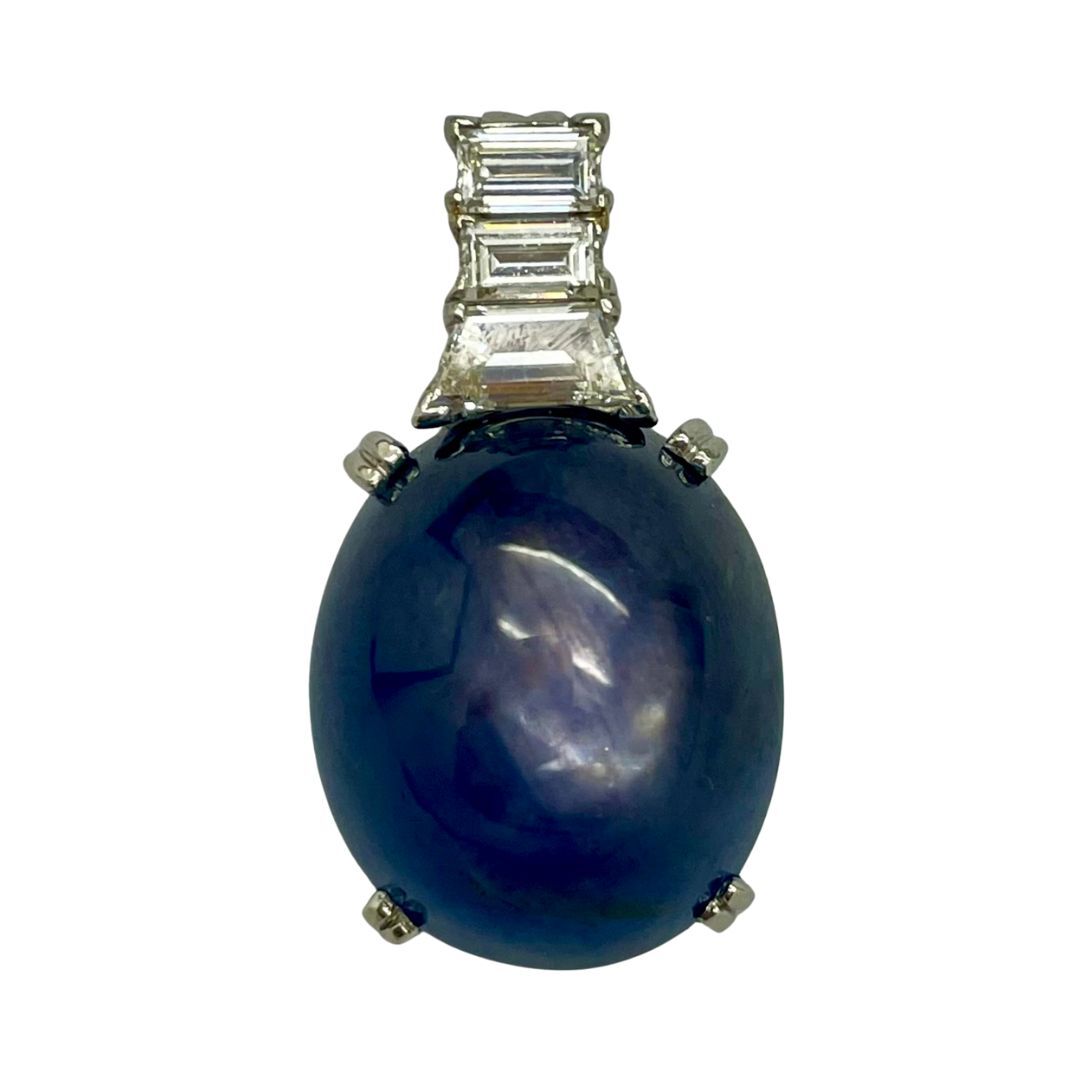 Blue sapphire gemstone pendant on a white background