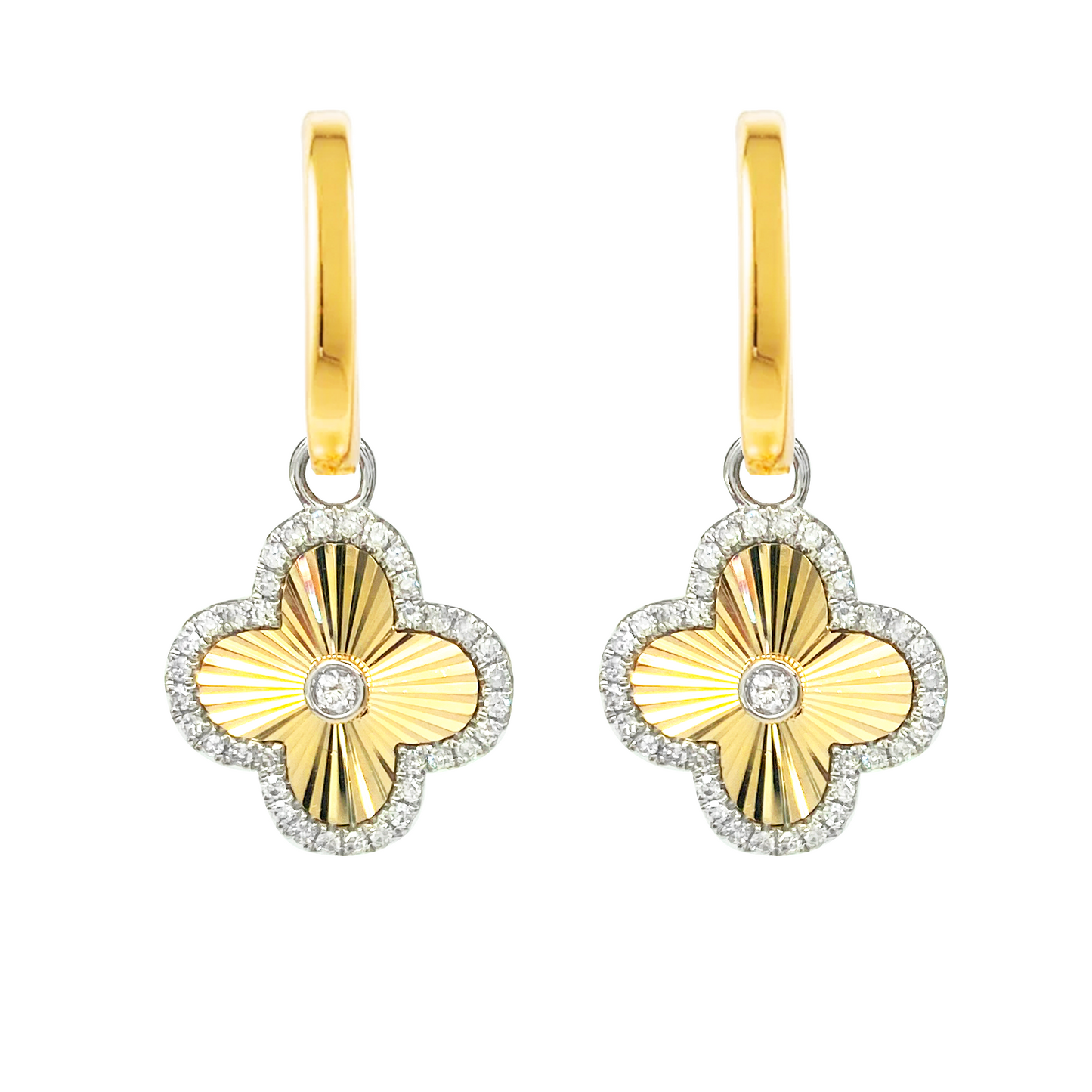 Gold hoop earrings with a clover-shaped pendant set with diamonds. The background is white.