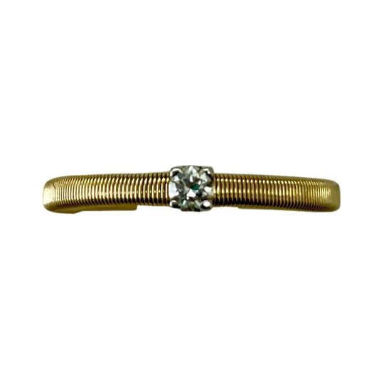 Gold ring with a diamond on a white background