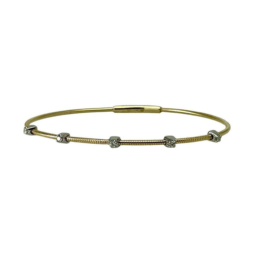 Gold bracelet with small beads on a white background