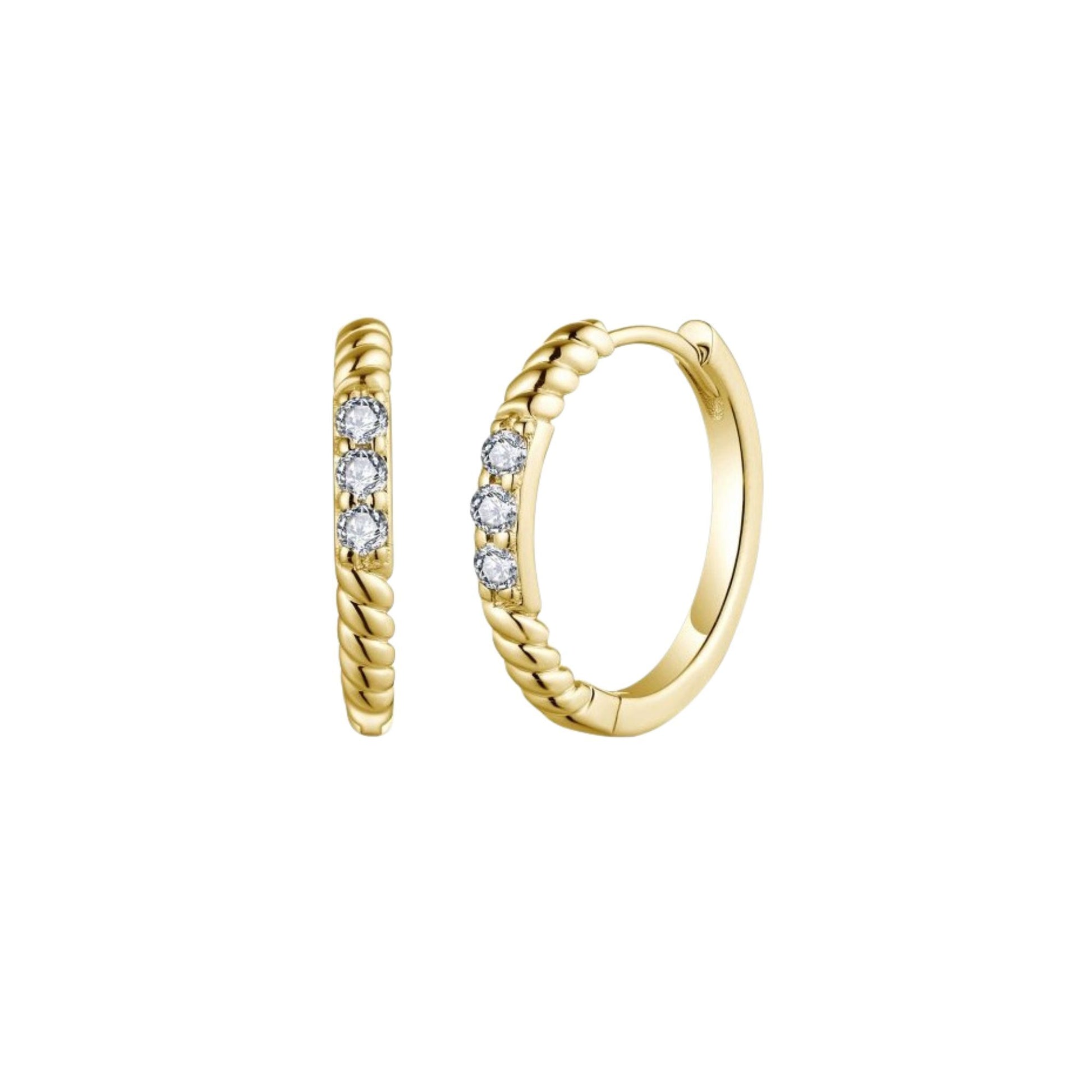 Gold hoop earrings with embedded diamonds on a white background