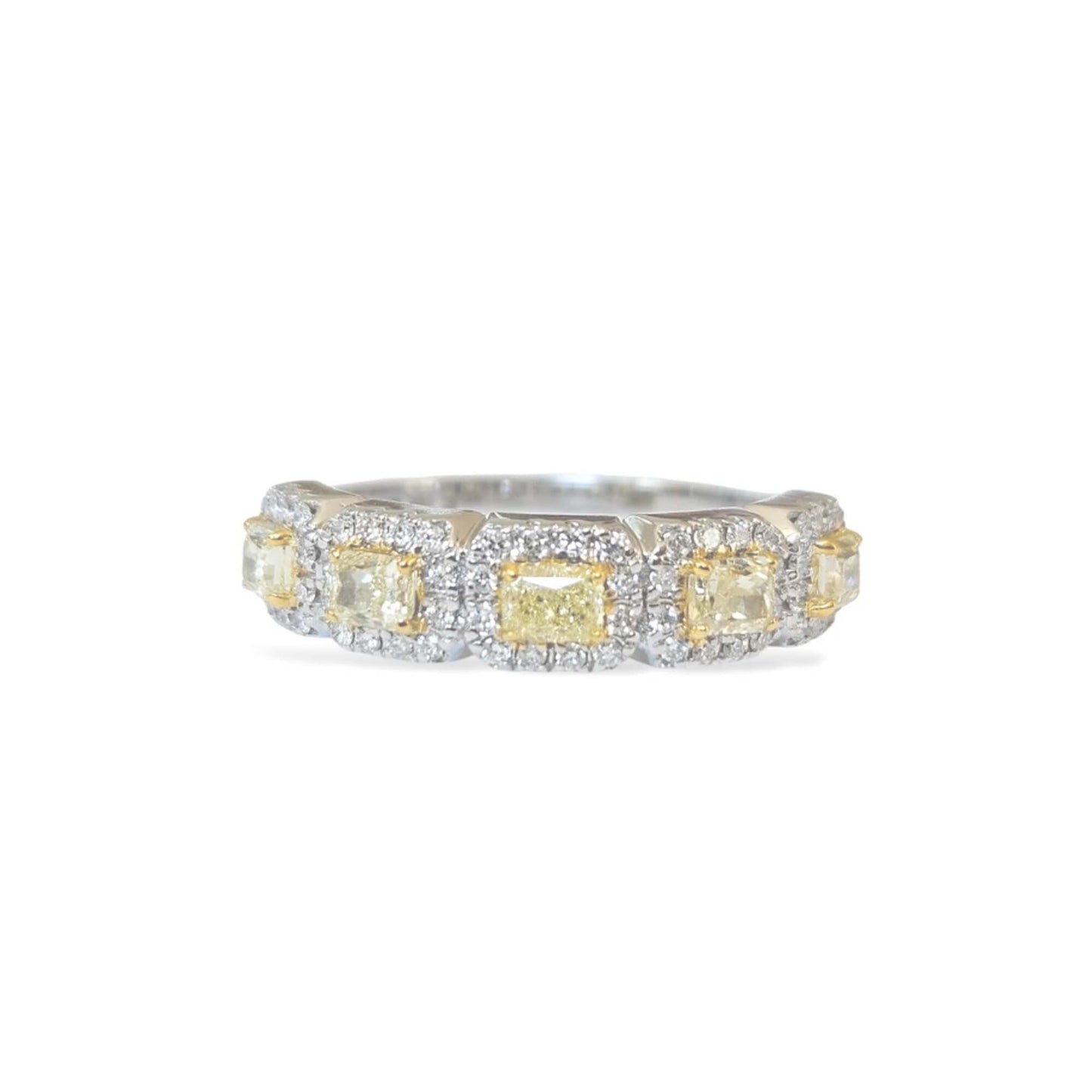 Ring with yellow gemstones and diamond accents on a white background