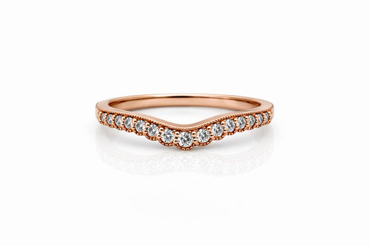 Rose gold ring with diamonds on a white background