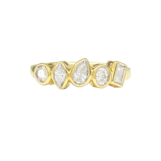Gold ring with five uniquely cut diamonds of various shapes set horizontally across the band, on a white background.