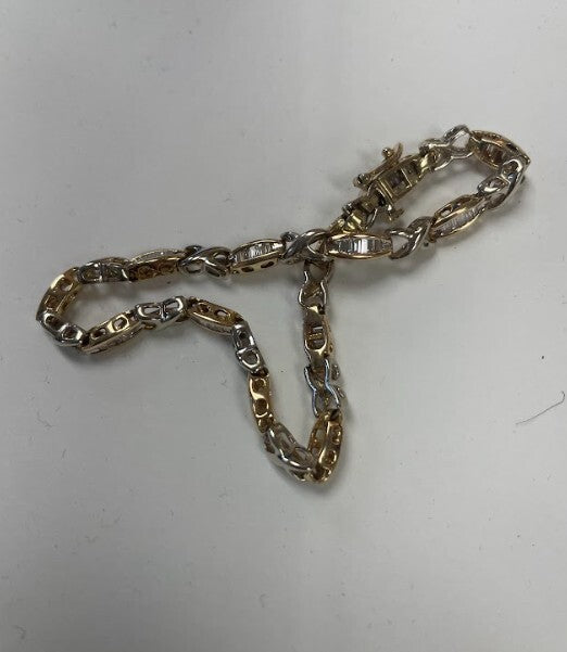 Gold chain necklace on a white background