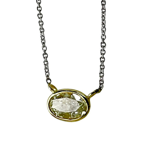 Necklace with a pendant featuring a clear stone on a white background