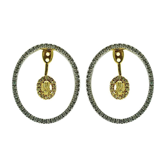 Pair of hoop earrings with gold and silver accents on a white background