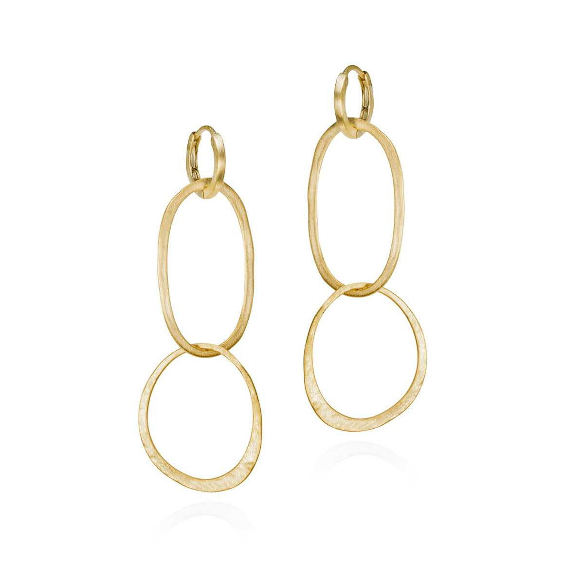 Gold hoop earrings on a white background