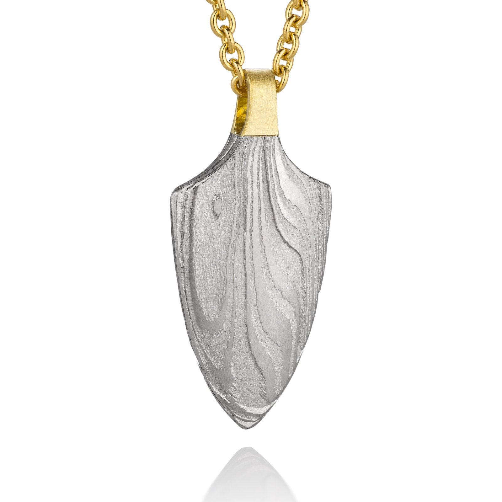 Gold shield-shaped Damascus necklace on a white background. 
