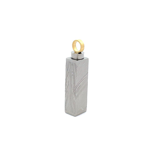 Silver Damascus steel pattern pendant, on a white background.