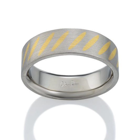 Two-tone silver and gold ring with a  striped pattern on a white background