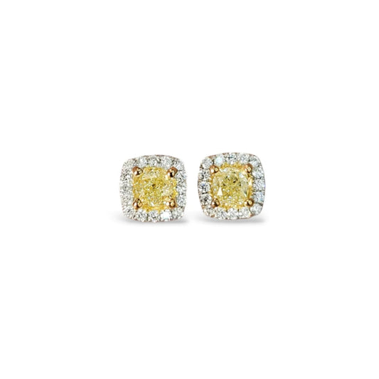 Pair of yellow diamond earrings on a white background