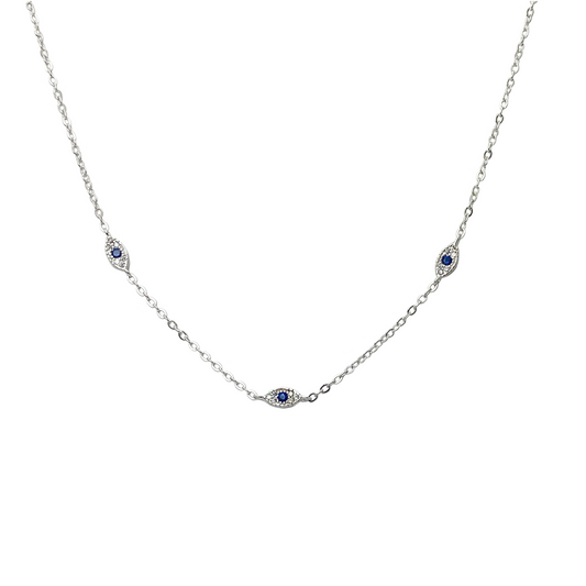 Silver necklace with small blue gemstones on a white background