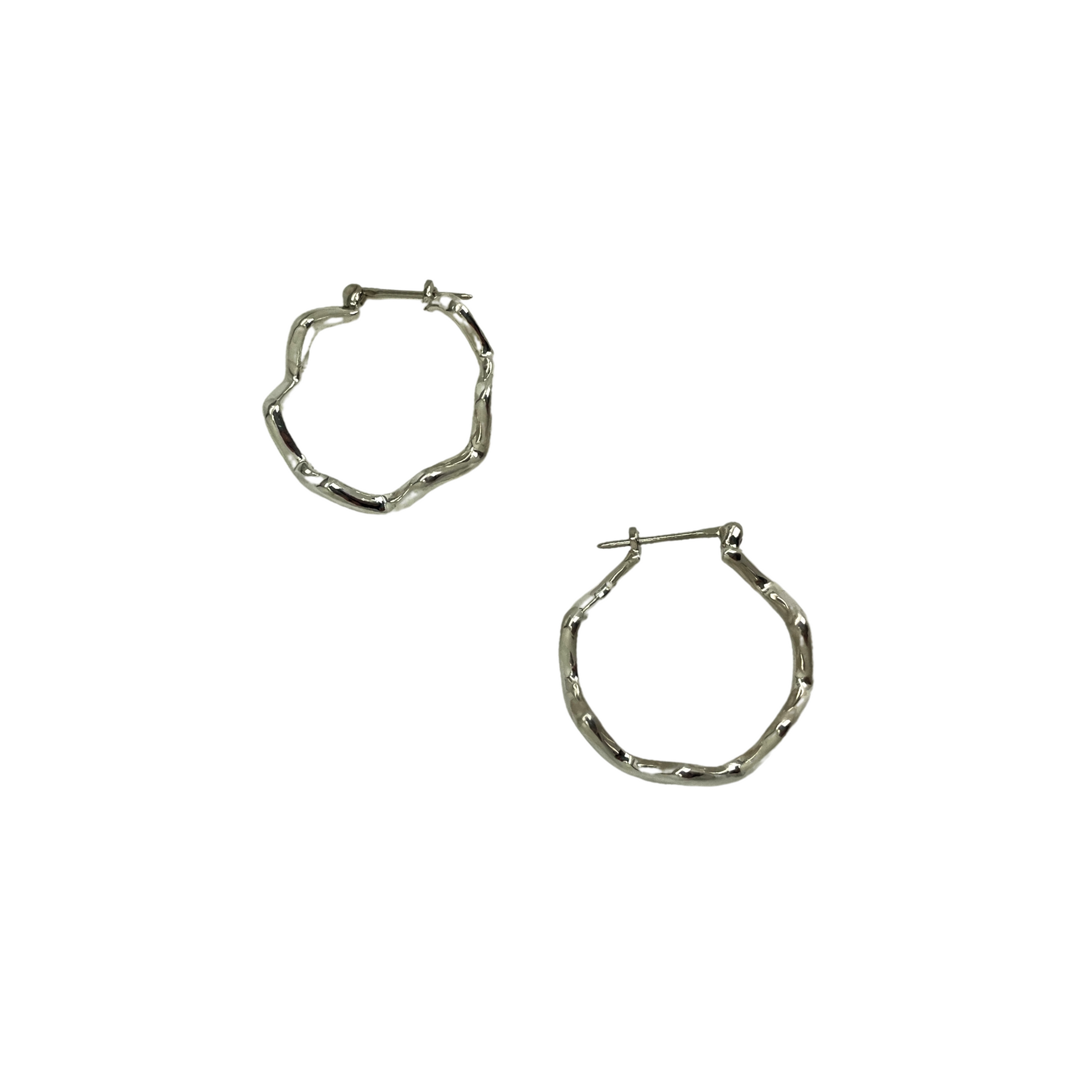 Pair of silver hoop earrings on a white background