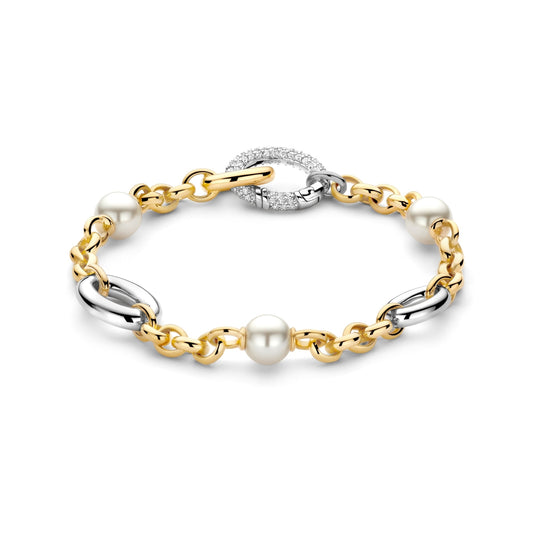 Gold, silver, and pearl bracelet on a white background