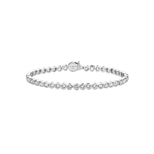 Silver bracelet with clear stones on a white background