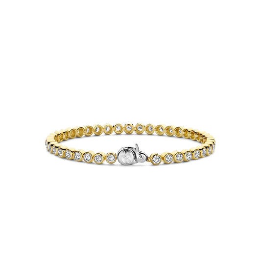 Gold bracelet with clear stones on a white background