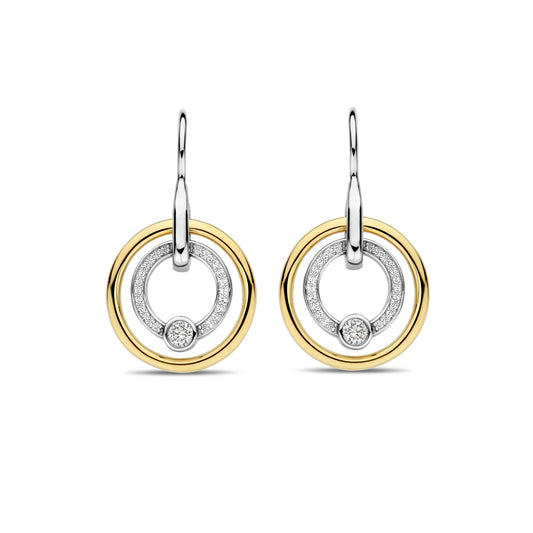 Pair of gold and silver hoop earrings on a white background