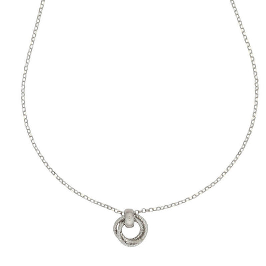 Silver necklace with a circular pendant on a white background