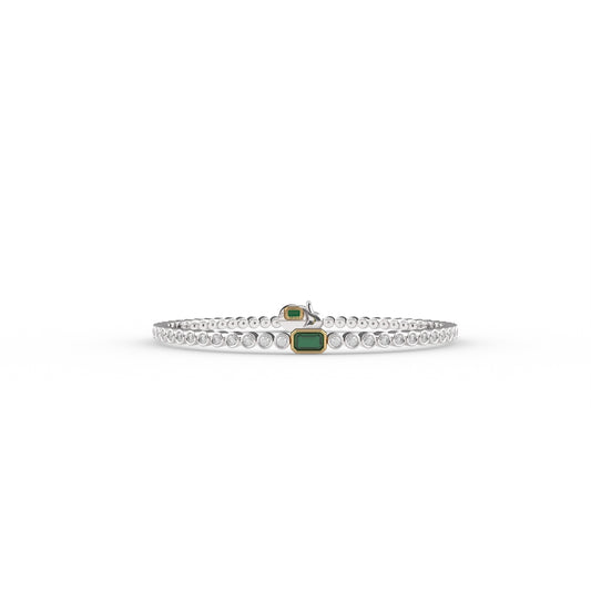 Silver bracelet with a green gemstone on a white background